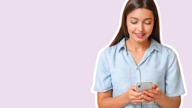 woman looks down at her smartphone