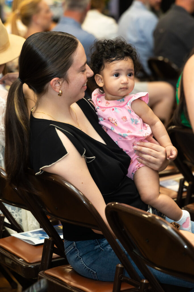 mom smiles at her baby girl